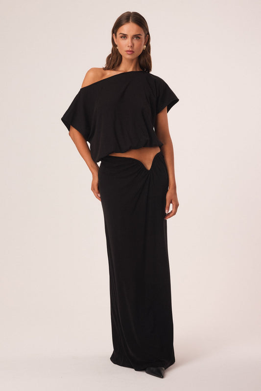 Image of a model wearing Skirts. Productname: SNDYS ALIA MAXI SKIRT in Black colour by brand - SNDYS