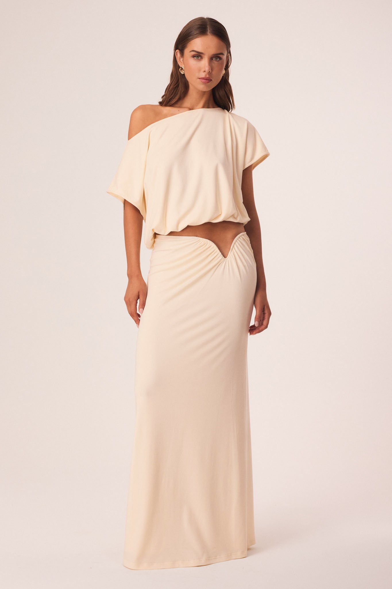 Image of a model wearing Skirts. Productname: SNDYS ALIA MAXI SKIRT in Cream colour by brand - SNDYS