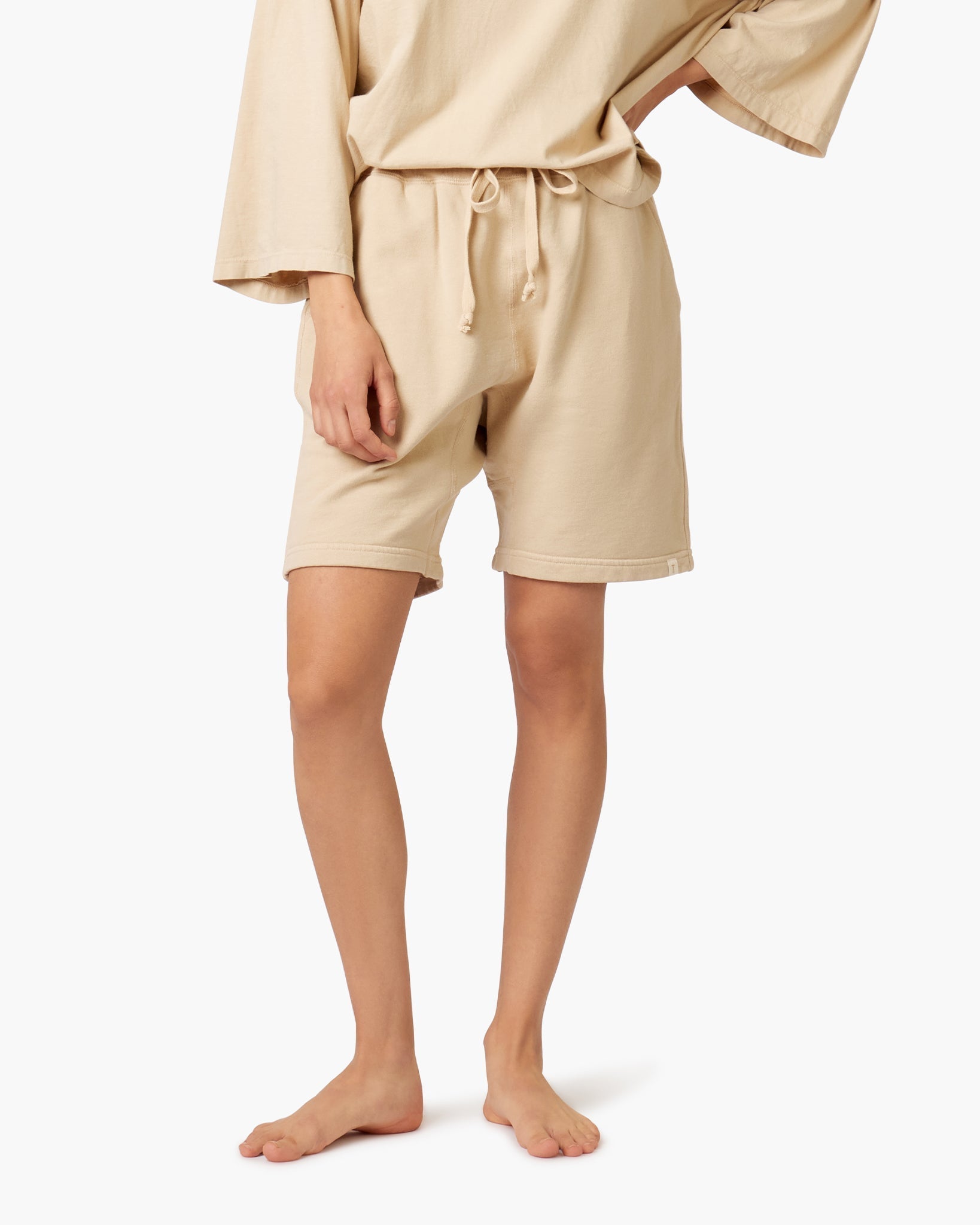 Image of a model wearing Shorts. Productname: Core Short Latte in Latte colour by brand - TKEES