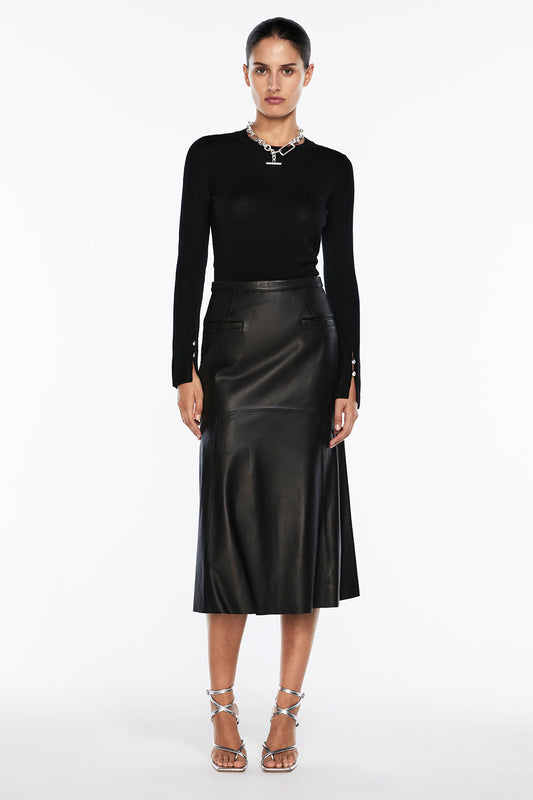 Image of a model wearing Skirts. Productname: The Fearless Leather Midi Skirt in Black colour by brand - Manning Cartell