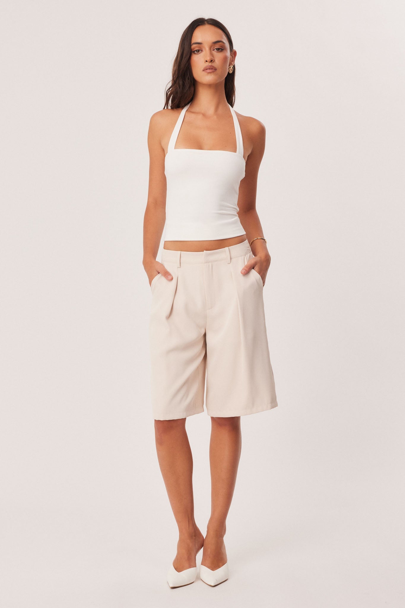 Image of a model wearing Shorts. Productname: SNDYS REECE BERMUDA SHORTS in Stone colour by brand - SNDYS