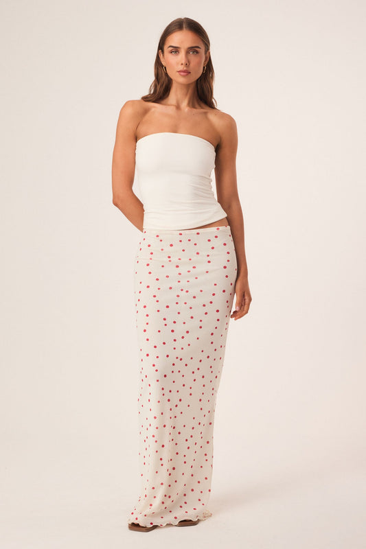 Image of a model wearing Skirts. Productname: SNDYS SAVANNAH MAXI SKIRT in Vanilla Polka Dot colour by brand - SNDYS