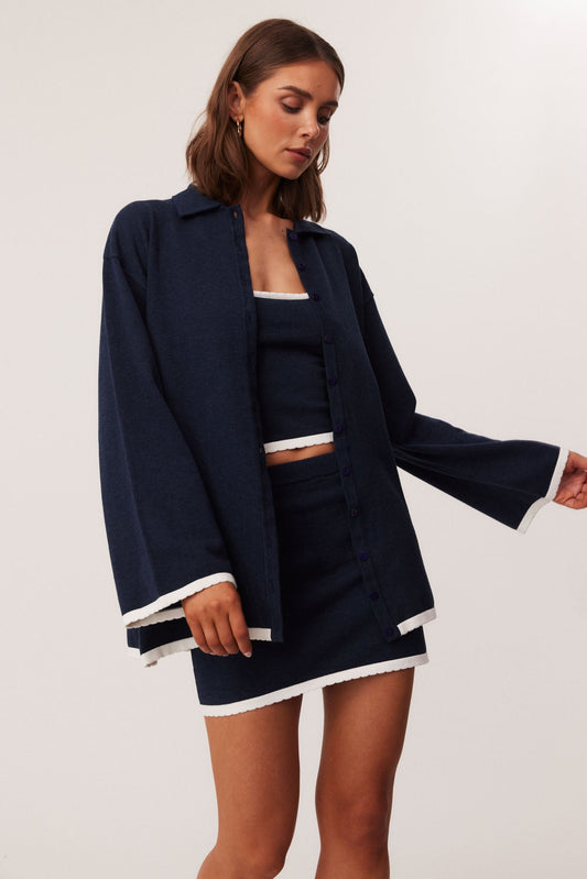 Image of a model wearing Outerwear. Productname: SNDYS CAMPBELL CARDIGAN in Navy colour by brand - SNDYS