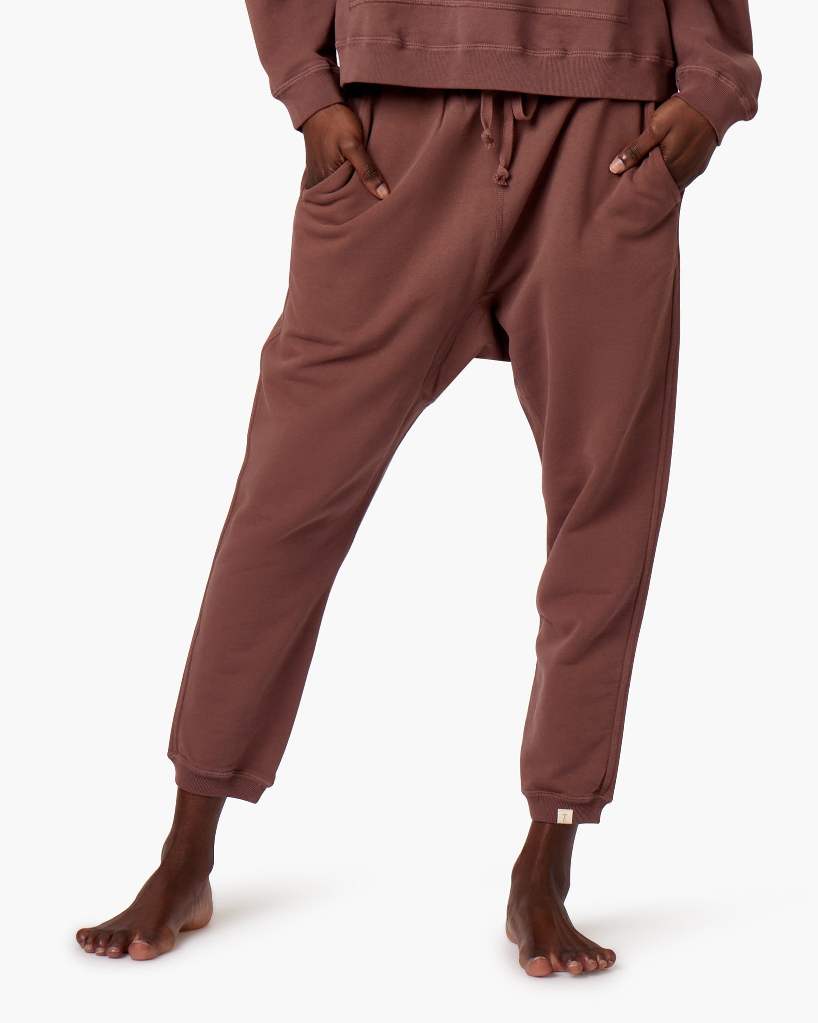 Image of a model wearing Pants. Productname: Core Jogger Cafe in Cafe colour by brand - TKEES