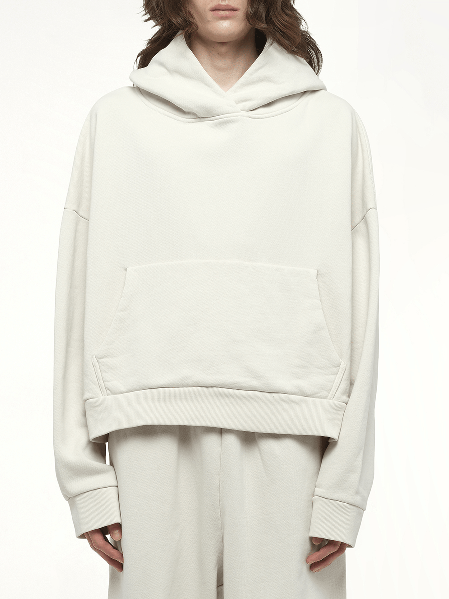 Image of a model wearing Outerwear. Productname: ENTIRE STUDIOS Heavy Hood in WHITE colour by brand - ENTIRE STUDIOS