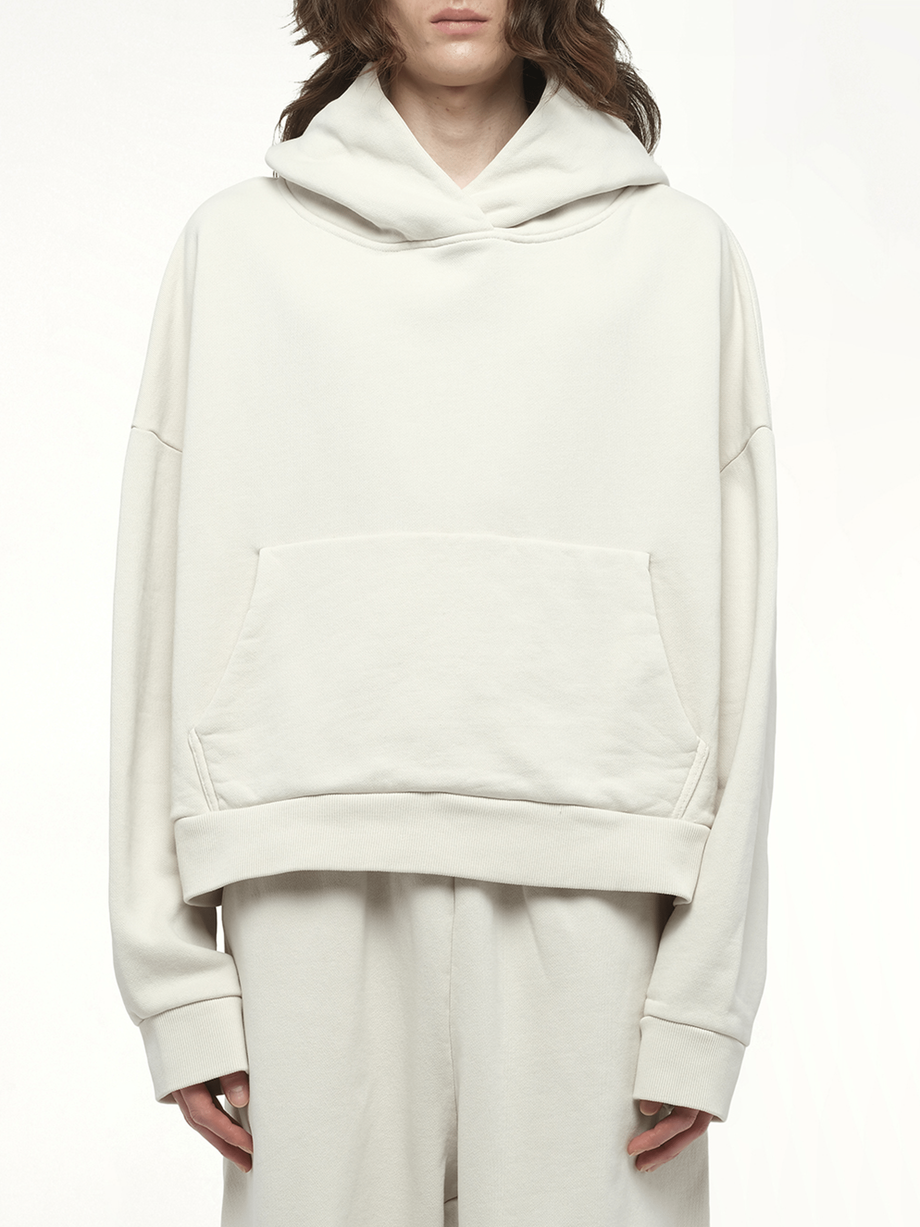 Image of a model wearing Outerwear. Productname: ENTIRE STUDIOS Heavy Hood in WHITE colour by brand - ENTIRE STUDIOS