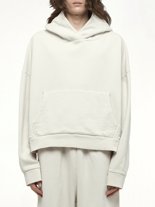 Image of a model wearing Outerwear. Product name - Heavy Hood in White colour by brand - ENTIRE STUDIOS