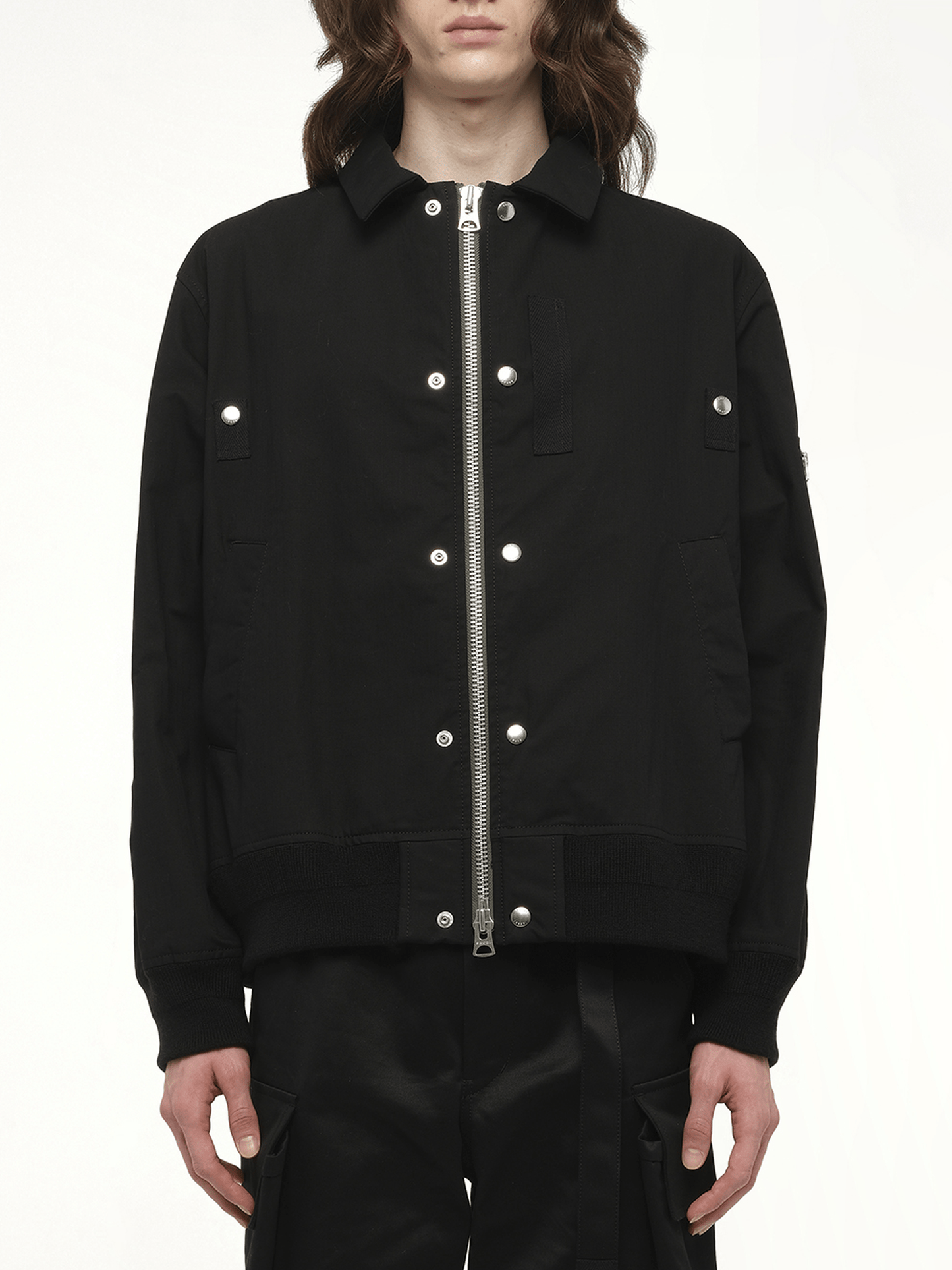 Image of a model wearing Outerwear. Productname: SACAI Rip Stop Blouson in Black colour by brand - SACAI