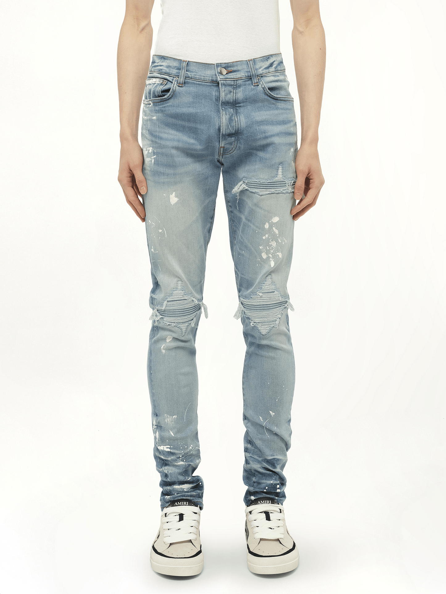 Image of a model wearing Denim. Productname: AMIRI Painter Denim MX1 Jeans in Blue colour by brand - AMIRI