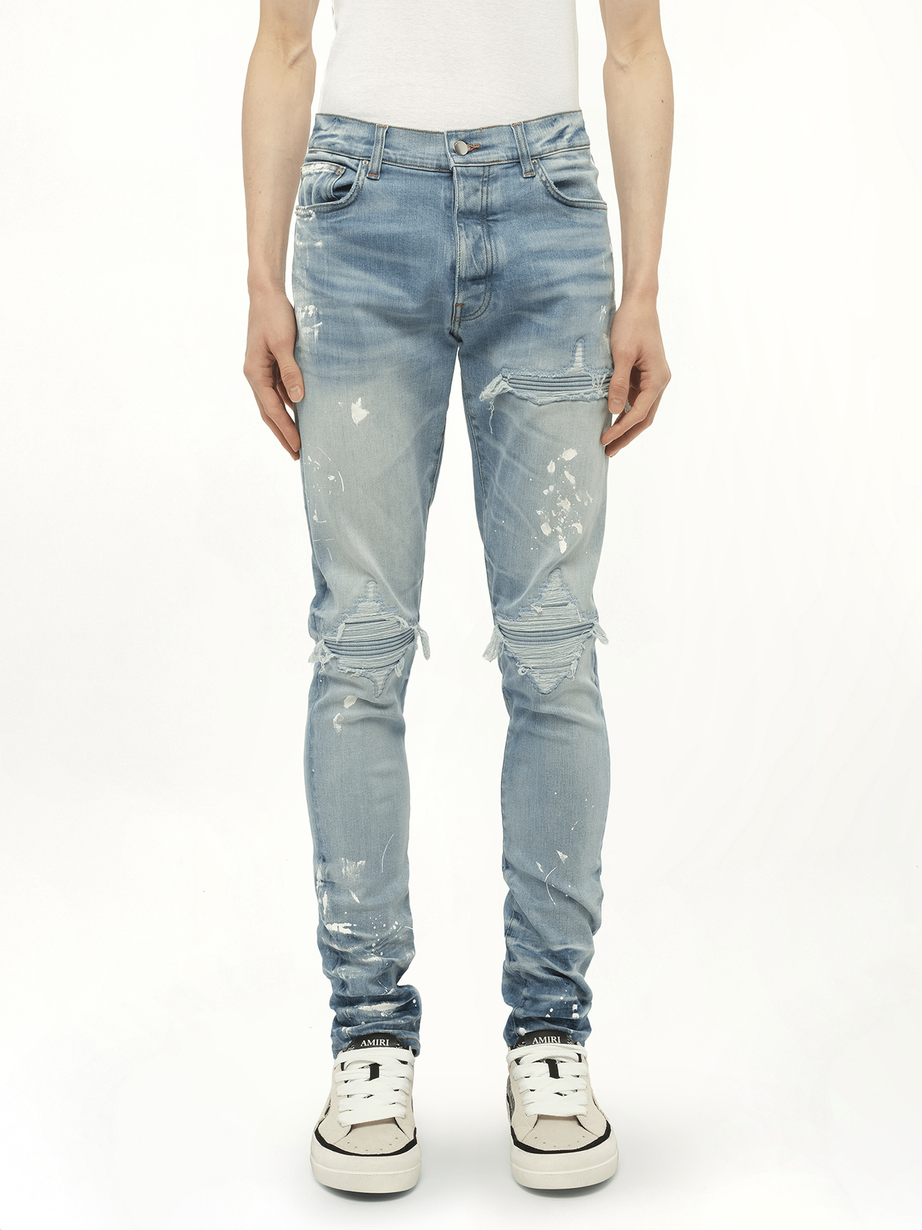 Image of a model wearing Denim. Productname: AMIRI Painter Denim MX1 Jeans in Blue colour by brand - AMIRI