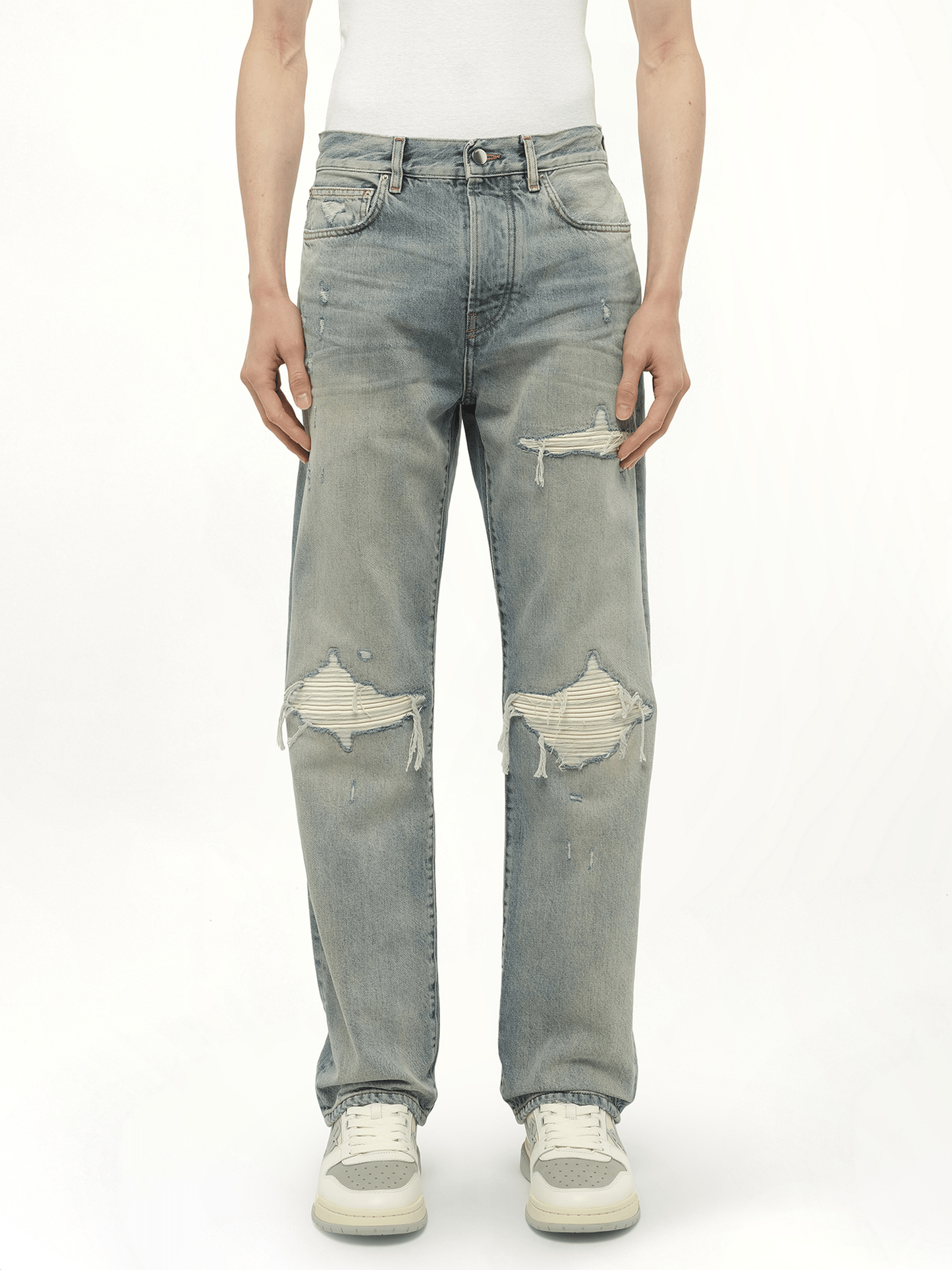 Image of a model wearing Denim. Productname: AMIRI Suede Straight MX1 Jeans in Blue colour by brand - AMIRI