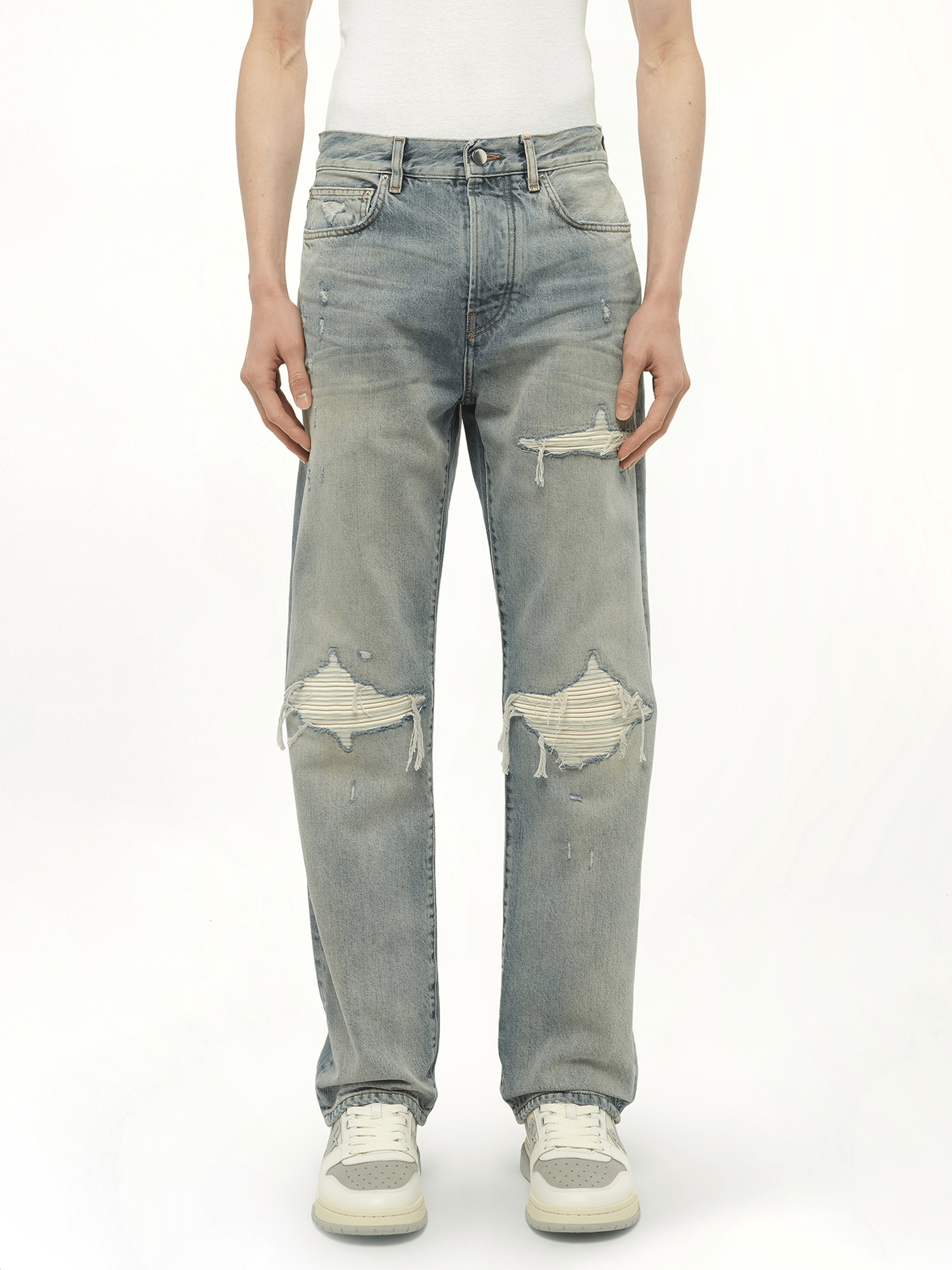 Image of a model wearing Denim. Productname: AMIRI Suede Straight MX1 Jeans in Blue colour by brand - AMIRI