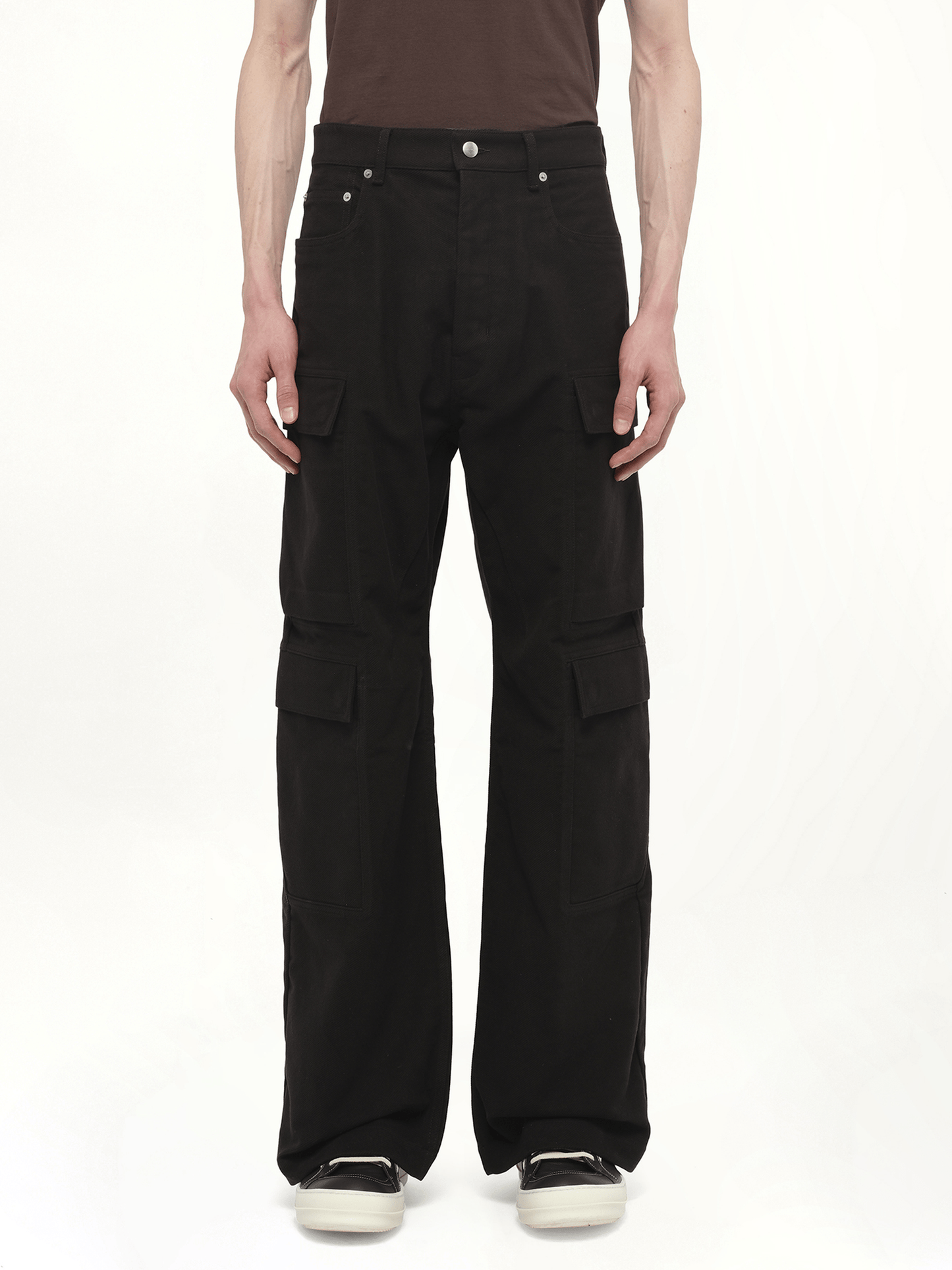 Image of a model wearing Denim. Productname: RICK OWENS Double Cargo Jeans in Black colour by brand - RICK OWENS