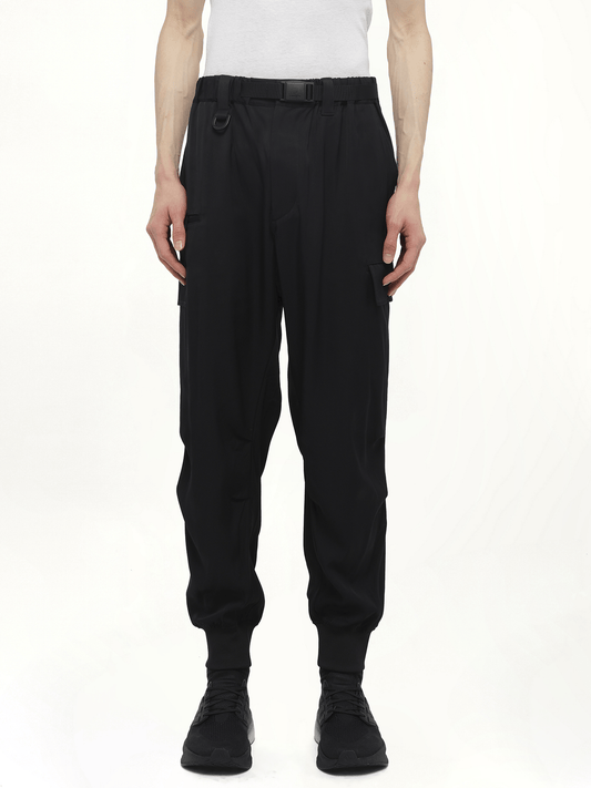 Image of a model wearing Pants. Productname: Y-3 Rayon Twill Cuffed Pants in Black colour by brand - Y-3