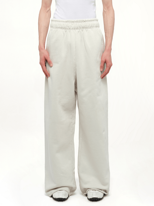 Image of a model wearing Pants. Productname: ENTIRE STUDIOS Full Sweatpants in WHITE colour by brand - ENTIRE STUDIOS