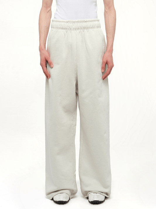 Image of a model wearing Pants. Product name - Full Sweatpants in White colour by brand - ENTIRE STUDIOS