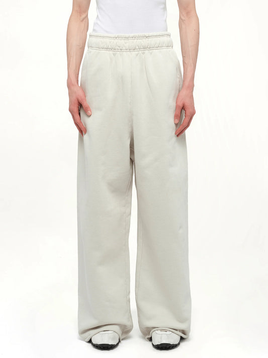 Image of a model wearing Pants. Product name - Full Sweatpants in White colour by brand - ENTIRE STUDIOS