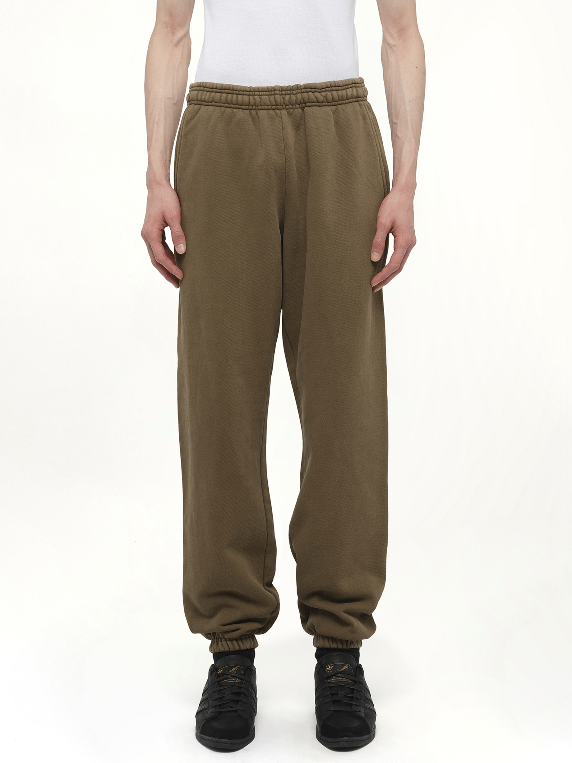 Image of a model wearing Pants. Productname: Heavy Sweatpants in Brown colour by brand - ENTIRE STUDIOS