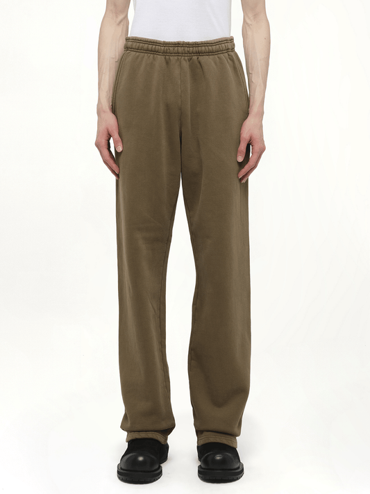 Image of a model wearing Pants. Productname: ENTIRE STUDIOS Straight-Leg Sweatpants in BROWN colour by brand - ENTIRE STUDIOS