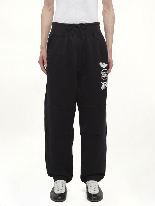 Image of a model wearing Pants. Productname: Y-3 Cuffed Track Pant in Black colour by brand - Y-3