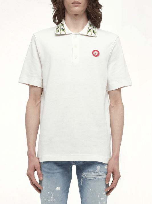 Image of a model wearing Tops. Productname: CASABLANCA Classic Laurel Pique Polo in WHITE colour by brand - CASABLANCA