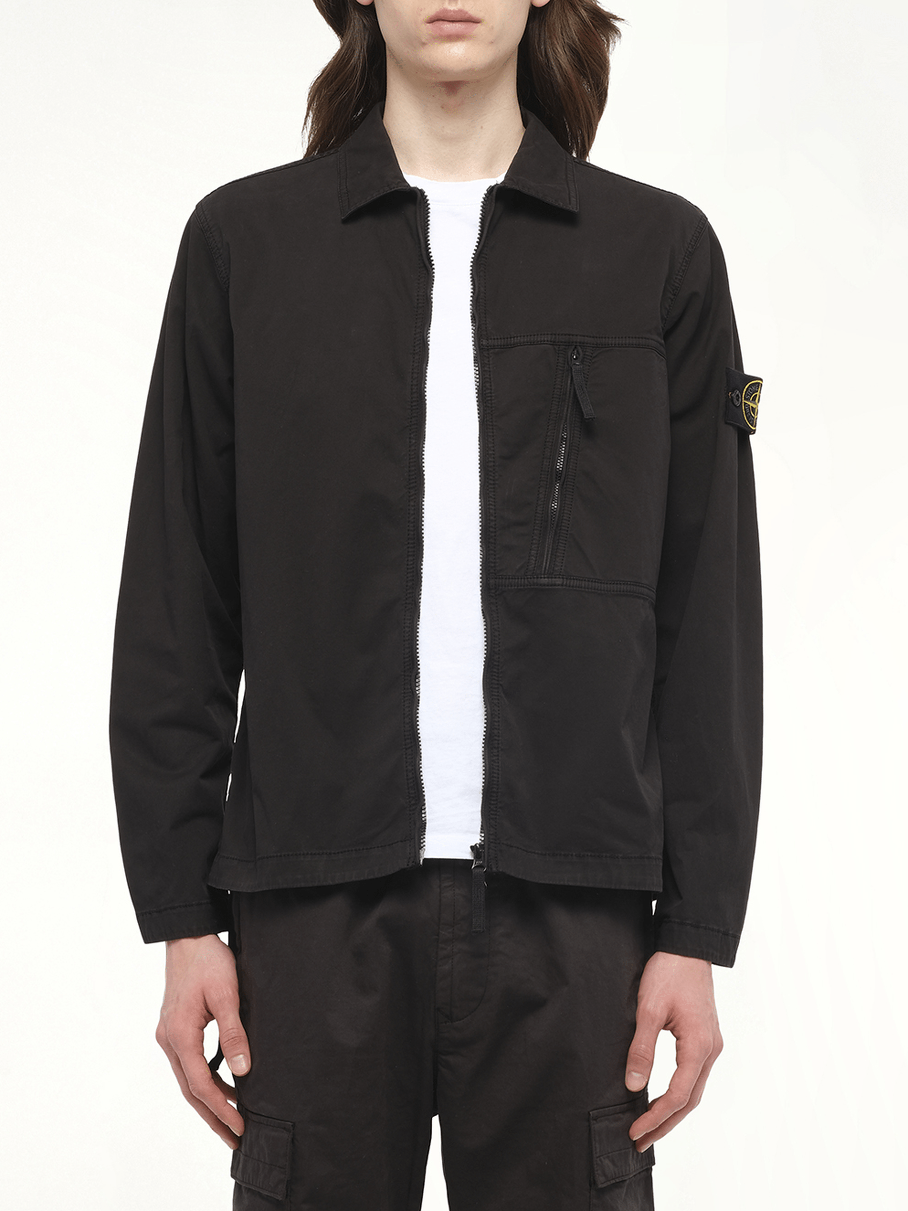 Image of a model wearing Tops. Product name - 120000 Supima Overshirt in Black colour by brand - STONE ISLAND