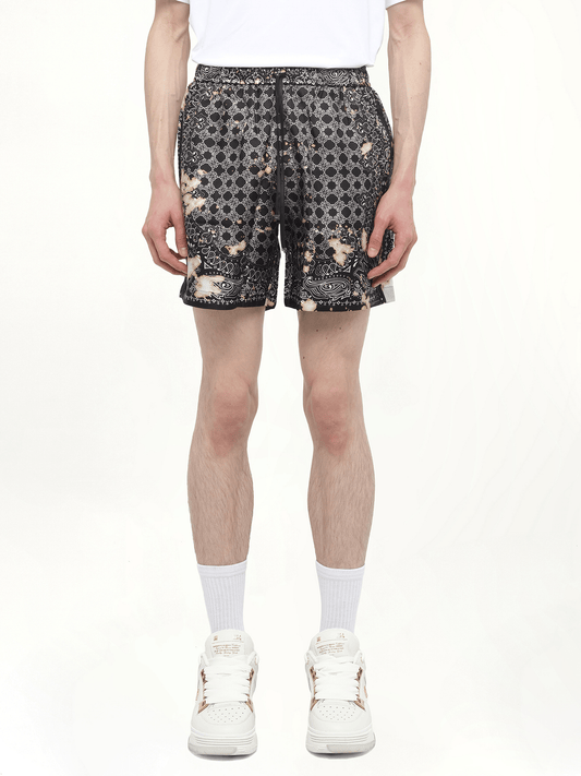 Image of a model wearing Shorts. Productname: AMIRI Bleach Bandana Silk Shorts in BLACK colour by brand - AMIRI