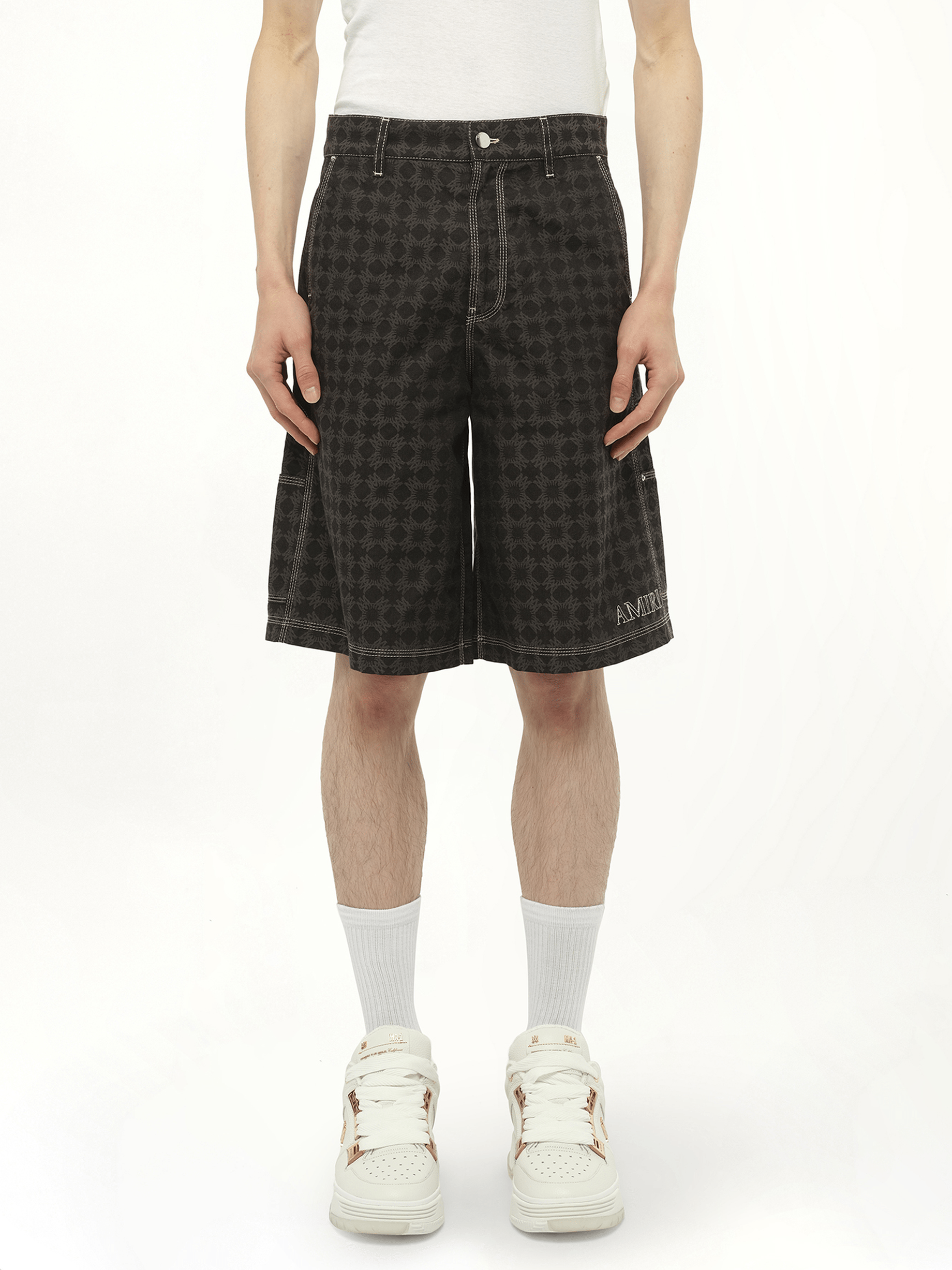 Image of a model wearing Shorts. Productname: AMIRI MA Quad Work Shorts in BLACK colour by brand - AMIRI