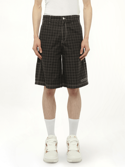 Image of a model wearing Shorts. Productname: AMIRI MA Quad Work Shorts in BLACK colour by brand - AMIRI