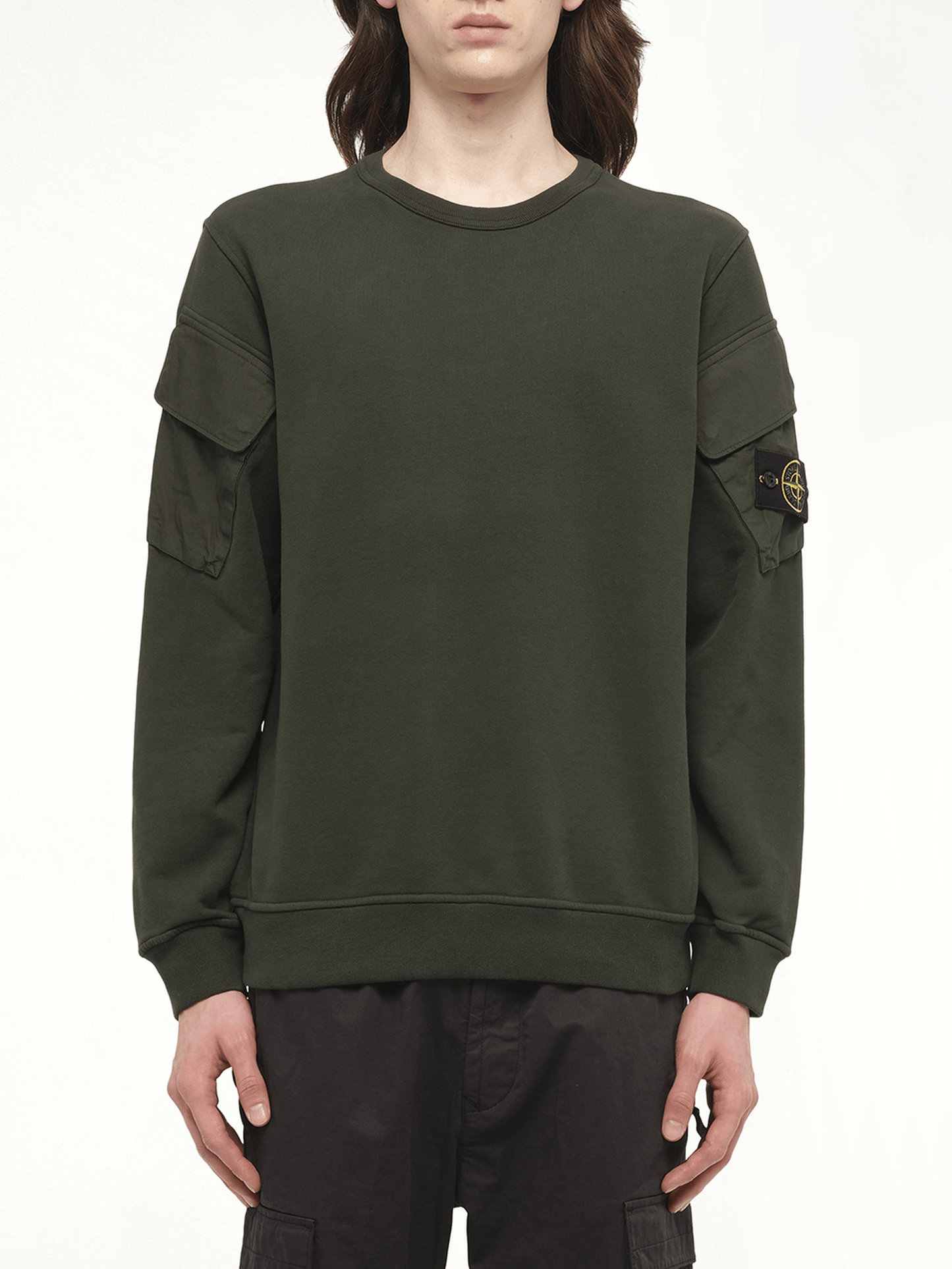 Image of a model wearing Outerwear. Product name - 610000 Cotton Fleece Sweatshirt in Green colour by brand - STONE ISLAND