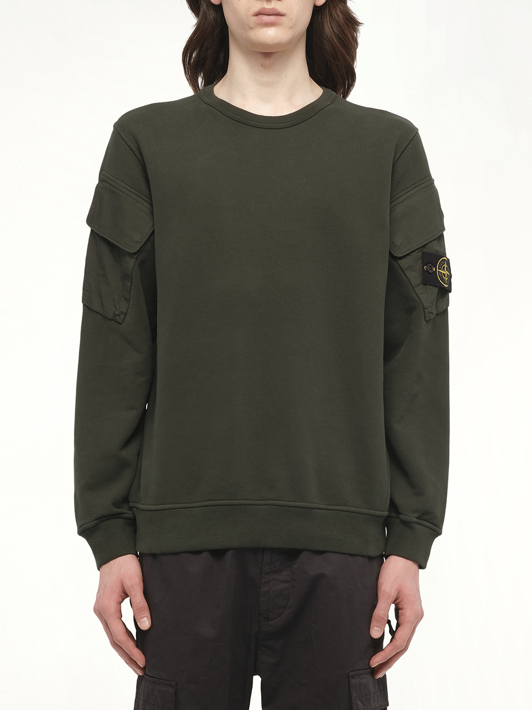 Image of a model wearing Outerwear. Product name - 610000 Cotton Fleece Sweatshirt in Green colour by brand - STONE ISLAND