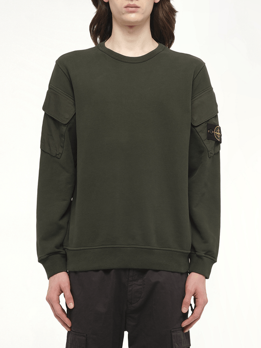 Image of a model wearing Outerwear. Product name - 610000 Cotton Fleece Sweatshirt in Green colour by brand - STONE ISLAND