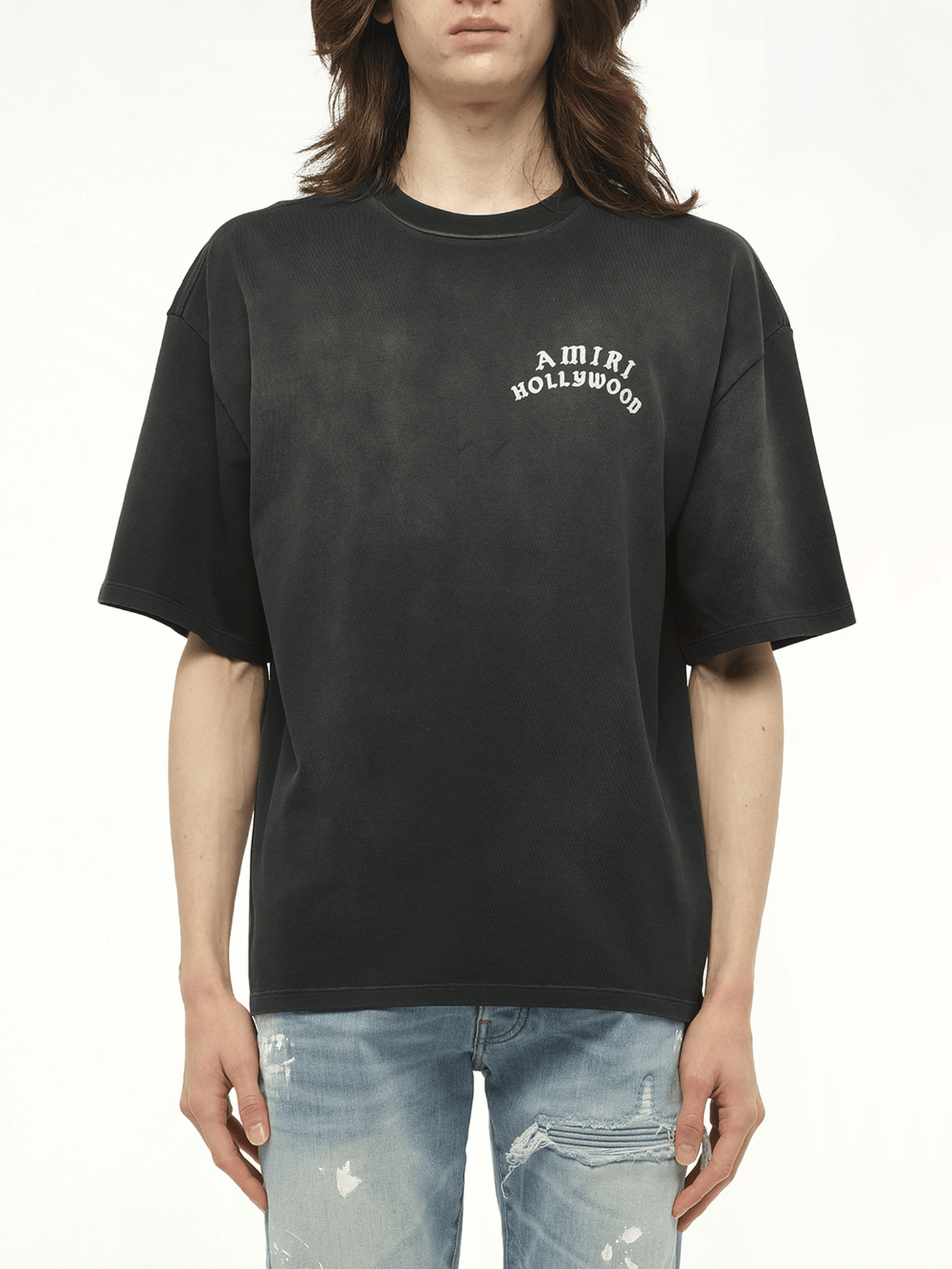 Image of a model wearing Tops. Productname: AMIRI Amiri Hollywood T-Shirt in BLACK colour by brand - AMIRI