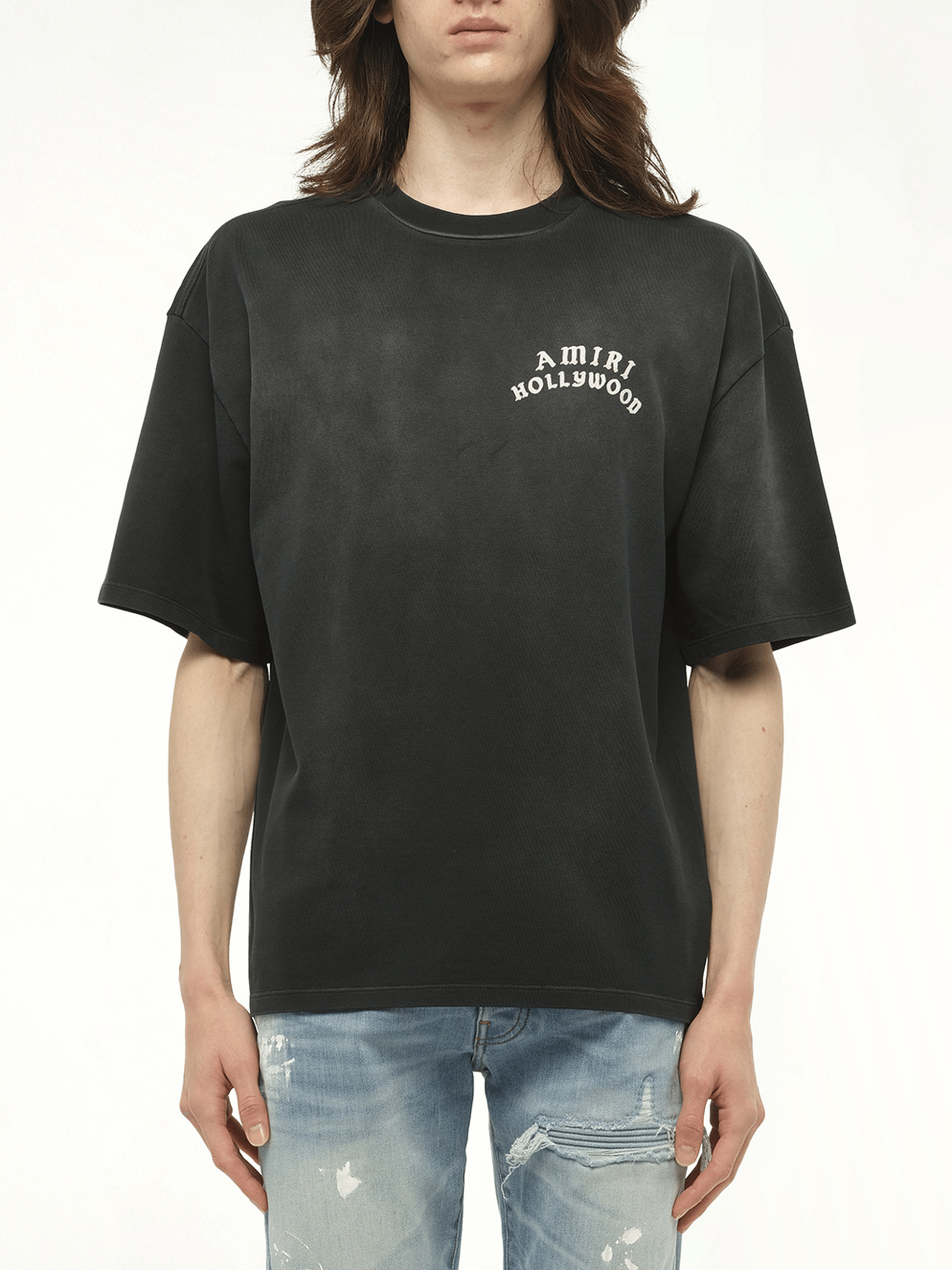 Image of a model wearing Tops. Productname: AMIRI Amiri Hollywood T-Shirt in BLACK colour by brand - AMIRI