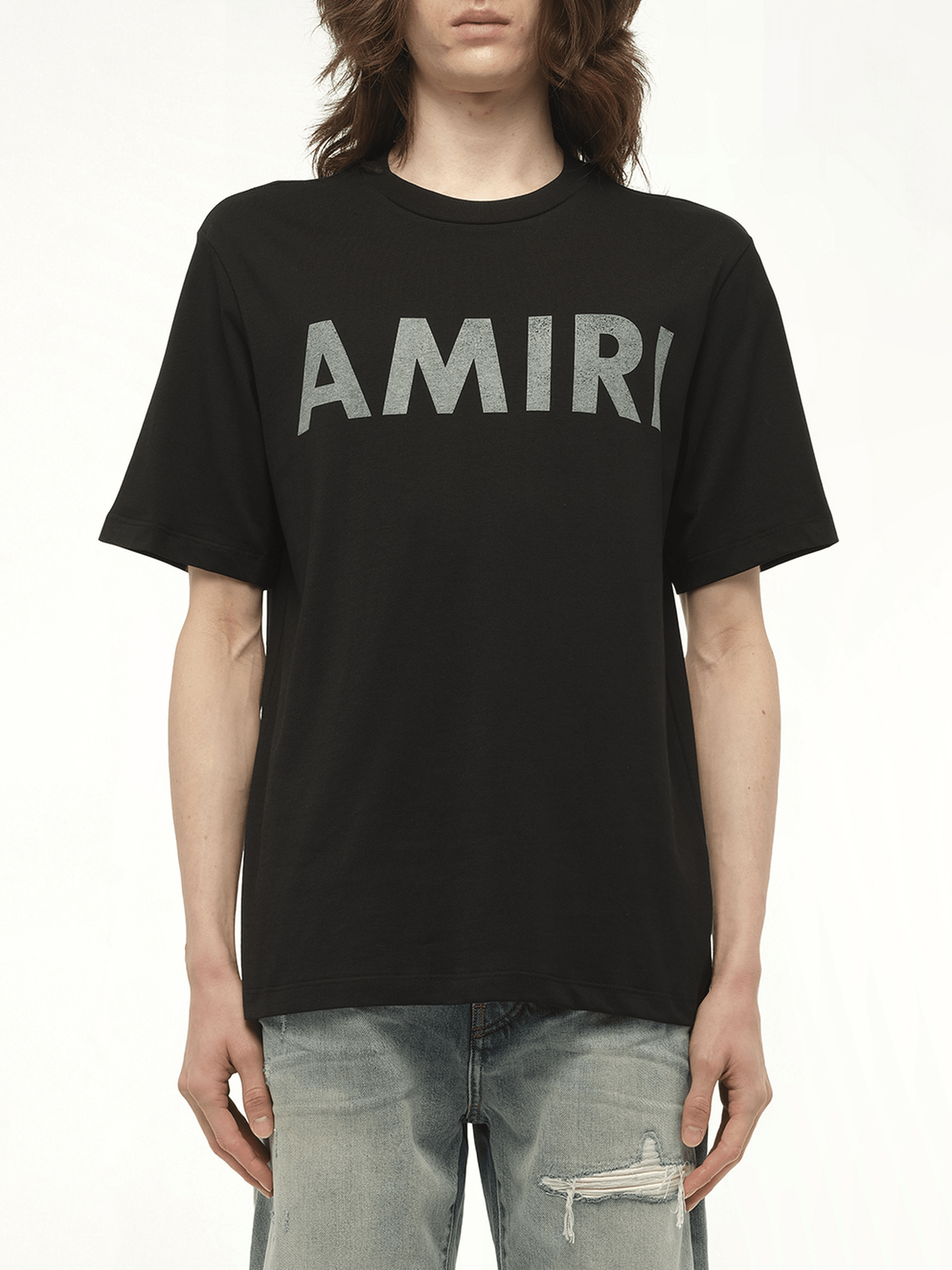 Image of a model wearing Tops. Productname: AMIRI Amiri Stencil T-Shirt in BLACK colour by brand - AMIRI