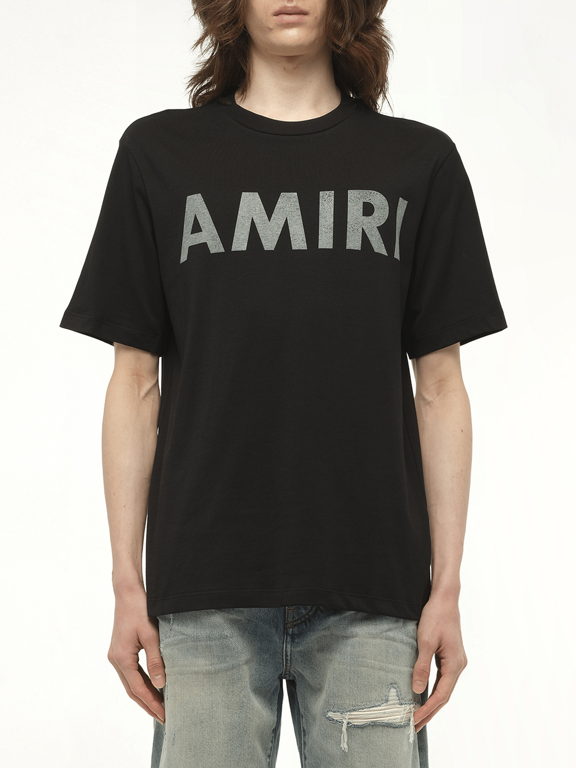 Image of a model wearing Tops. Productname: AMIRI Amiri Stencil T-Shirt in BLACK colour by brand - AMIRI