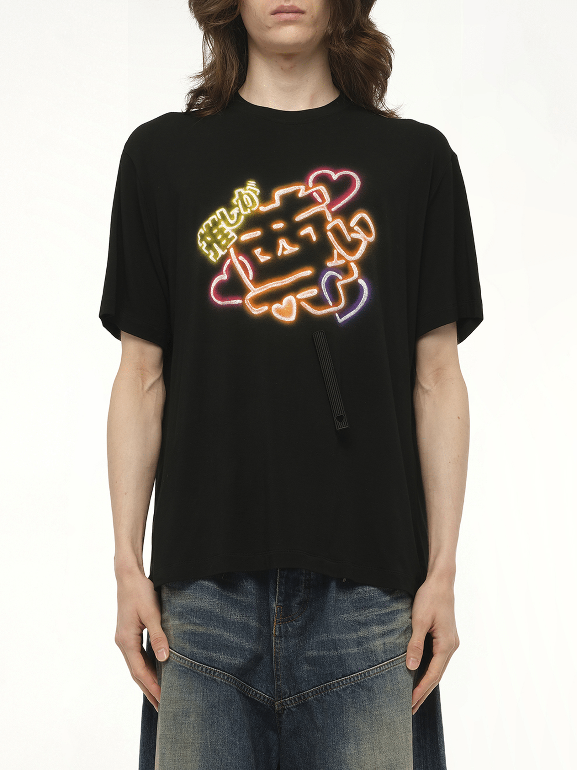 Image of a model wearing Tops. Productname: DOUBLET Big Japanese Neon Paint Fan Service T-Shirt in BLACK colour by brand - DOUBLET