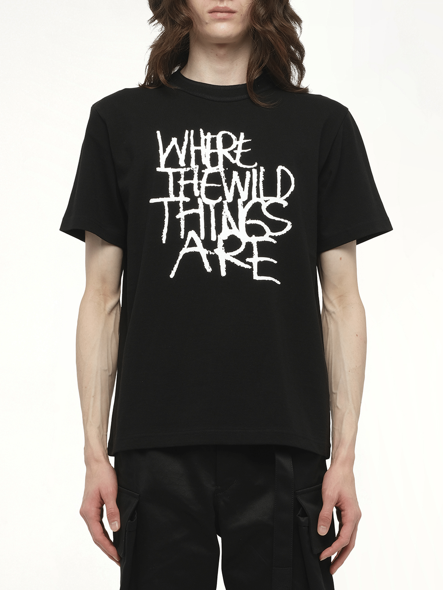 Image of a model wearing Tops. Productname: SACAI WHERE THE WILD THINGS ARE Logo T-Shirt in Black colour by brand - SACAI