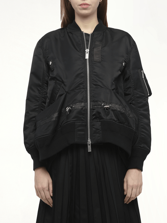 Image of a model wearing Pants. Productname: SACAI Nylon Twill Blouson with Drawstring in Black colour by brand - SACAI