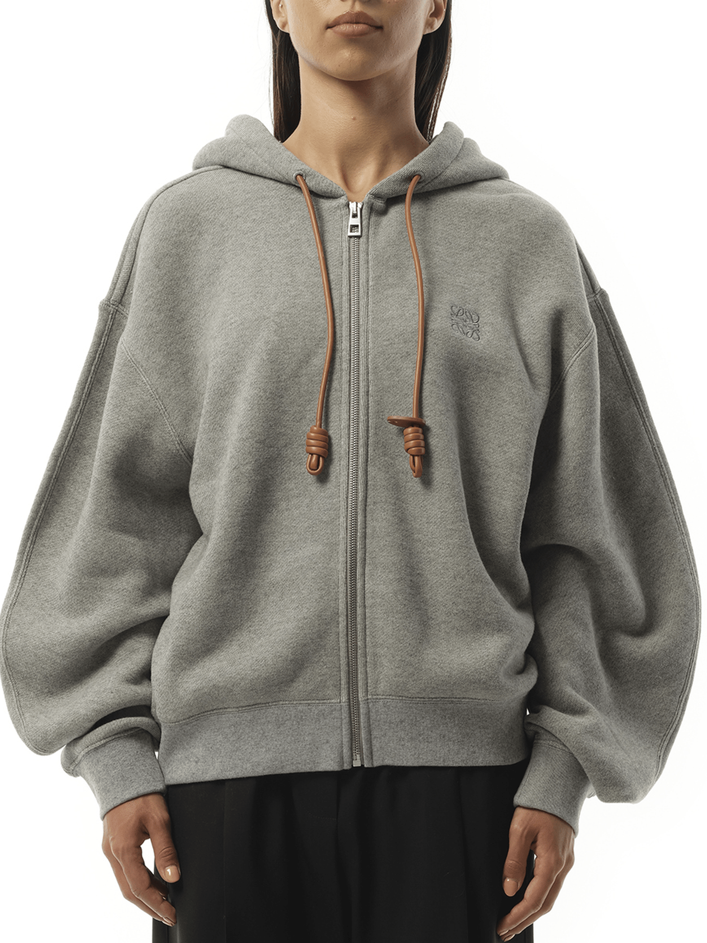 Image of a model wearing Outerwear. Product name - Flamenco Zip Hoodie in Grey colour by brand - LOEWE