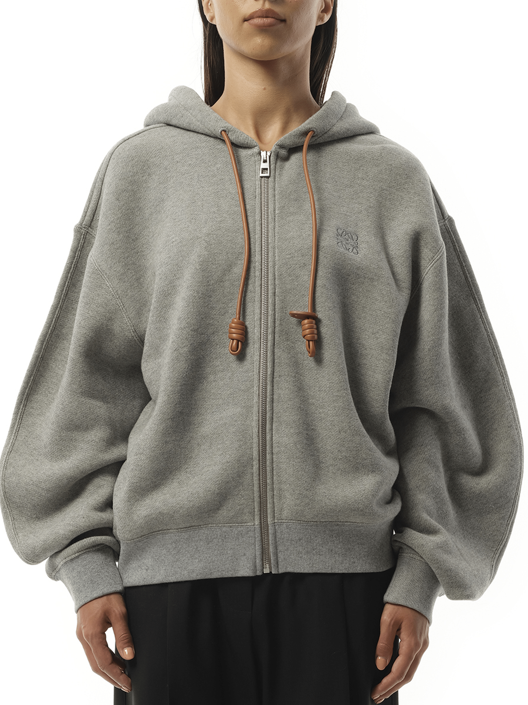 Image of a model wearing Outerwear. Product name - Flamenco Zip Hoodie in Grey colour by brand - LOEWE