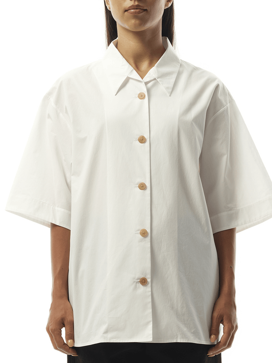 Image of a model wearing Tops. Productname: KHAITE Owen Top in White colour by brand - KHAITE