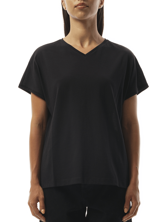 Image of a model wearing Tops. Productname: KHAITE Devra Top in Black colour by brand - KHAITE