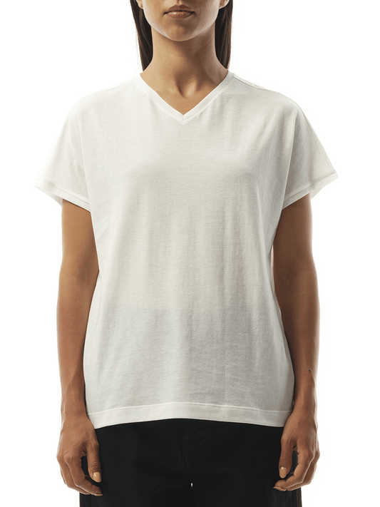 Image of a model wearing Tops. Productname: KHAITE Devra Top in CREAM colour by brand - KHAITE