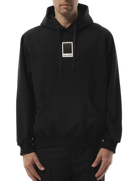 Image of a model wearing Outerwear. Productname: DOUBLET “Cheki” Rainbow-Film Hoodie in BLACK colour by brand - DOUBLET