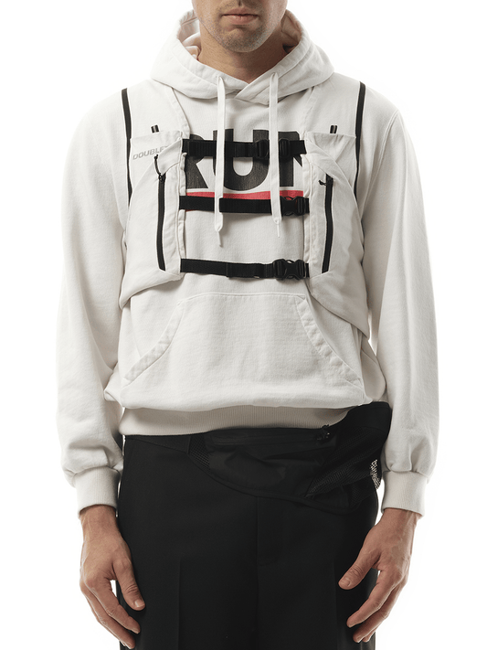 Image of a model wearing Outerwear. Productname: DOUBLET Trail Vest Hoodie in WHITE colour by brand - DOUBLET