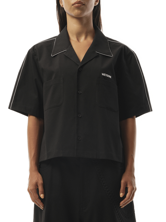 Image of a model wearing Tops. Productname: WE11DONE Short-Sleeved Convertible Shirt in BLACK colour by brand - WE11DONE