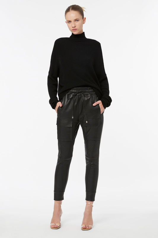Image of a model wearing Pants. Productname: Open Season Stretch Leather Pant in Black colour by brand - Manning Cartell
