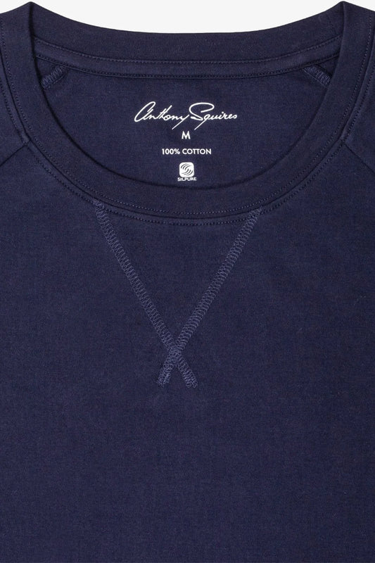 Image of a model wearing Tops. Product name - Hugh Navy Long Sleeve Sleep Top in Navy colour by brand - Anthony Squires
