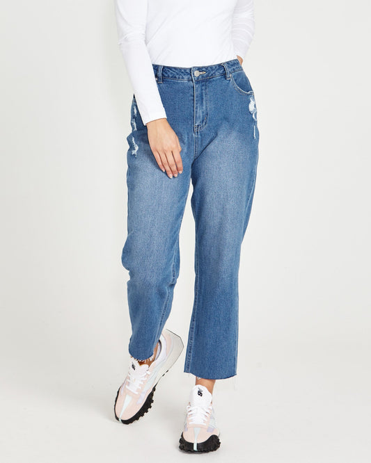 Image of a model wearing Pants. Product name - Mavourne Straight Leg High Waist Distressed Denim Jeans 80 Wash Blue in 80 Wash colour by brand - Sass Clothing